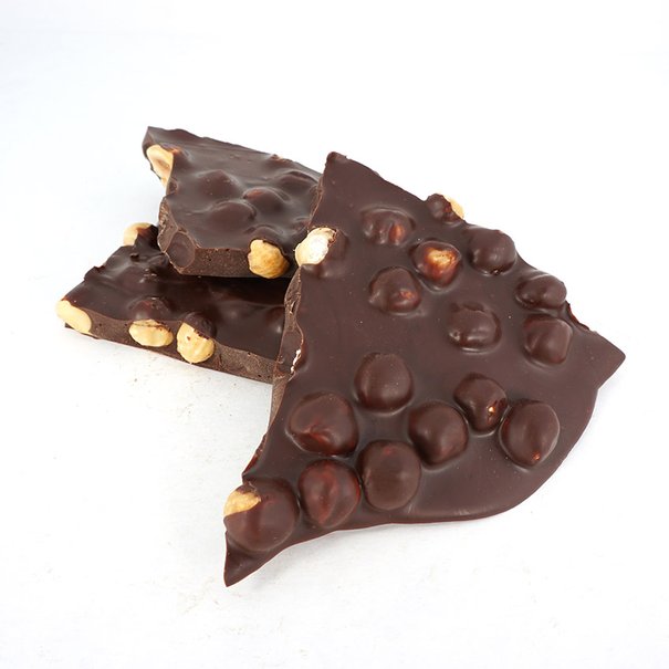 Plates of hazelnuts and dark chocolate